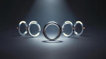 A group of silver rings on a dark background photo