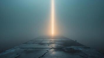 A long beam of light coming out of the fog photo