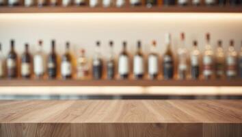 A wooden table in front of a row of bottles photo