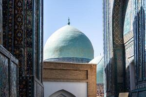 Samarkand, Uzbekistan-august 13, 2023-particular of the Shakhi Zinda necropolis, a famous mausoleum complex in Samarkand during a sunny day photo