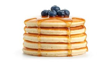 A stack of pancakes with blueberries on top photo