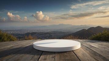 White Round Podium Display on Wooden Deck Overlooking Mountain Cityscape photo