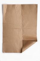 Folding Brown Paper Sheet Background with Corner Curl for Design photo
