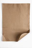 Blank Brown Paper Sheet with Corner Folded for Mockup Design photo