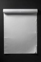 Blank Paper Roll Mockup on Black Wall Background for Presentation photo