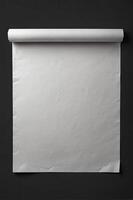 Blank White Paper Scroll on Dark Wall for Mockup or Presentation photo
