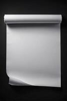 Blank White Paper Roll Over Dark Background Perfect for Presentations photo