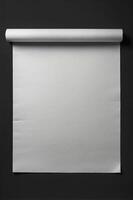 Blank White Paper Roll Hanging on Dark Wall Background Texture photo