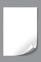 Blank White Paper Sheet with Folded Corner on Gray Background photo