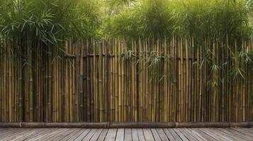 Bamboo Fence and Wooden Deck with Green Leaves in Natural Setting photo