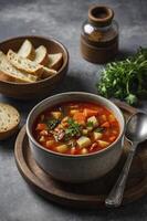 Bowl of Vegetable Soup with Bread and Oil for a Nutritious Meal photo