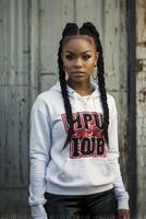 Stylish Woman with Braids Wearing Hoodie in Urban Fashion Portrait photo