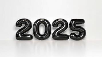 The number 2025 is made of black balloons photo