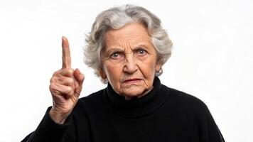 An older woman pointing her finger at something photo