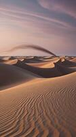 Sand Dune Landscape with Wind Erosion and Textured Surface at Sunset photo
