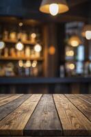 Rustic Wooden Table in Bar with Blurry Background and Hanging Lights photo