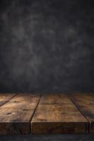 Rustic Wooden Table Surface with Dark Background for Product Display photo