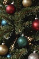 Decorating Christmas Tree with Colorful Ornaments and Festive Lights Close Up photo