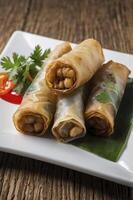 Serving Fresh Spring Rolls with Vegetables on White Plate photo