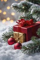 Gifts with Red Ribbon and Ornaments in Snowy Winter Scene photo
