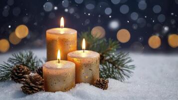 Glowing Candles with Pinecones and Snow for a Holiday Celebration photo