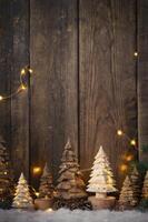 Arrangement of Wooden Christmas Trees with Fairy Lights on Wood Background photo