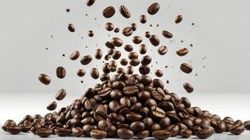 Flying Roasted Coffee Beans Falling Onto a Pile Against a White Background photo