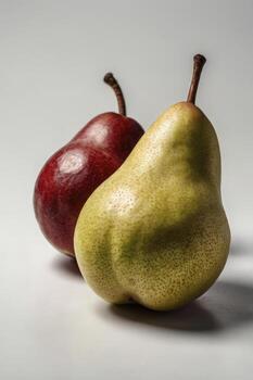Two Pears One Red and One Green on a Bright Background photo