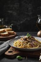 Serving Spaghetti Carbonara with Mushroom on Plate Ready to Eat photo