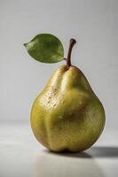 Fresh Green Pear Still Life with Leaf and Water Droplets photo