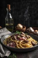 Serving of Spaghetti with Mushrooms and Ham on Dark Background photo