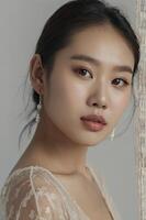 Elegant Young Woman Portrait with Pearl Earrings and Natural Makeup Style photo