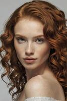 Portrait of a Red-haired Woman with Freckles and Gentle Expression in Studio photo