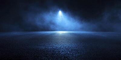 Spotlight Illuminating Dark Asphalt Surface with Smoky Blue Background photo