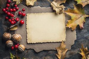 Autumn Card Mockup with Oak Leaves and Berries on Stone Background photo