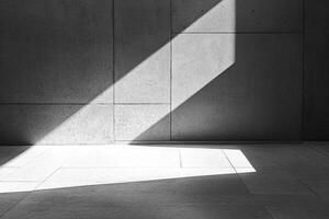 Sunlight Streaming Across Concrete Wall and Floor Creating Dramatic Light Play photo