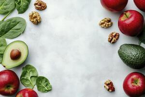 Arrangement of Fresh Apples Avocado Spinach and Walnuts on Clean Surface photo