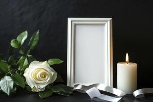 White Rose with Candle and Empty Picture Frame for Remembrance photo