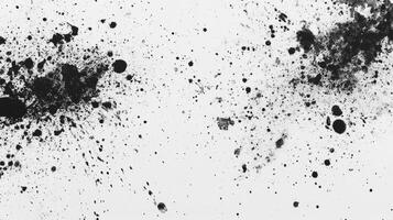 Ink Splatter Texture Background with Black Ink on White Paper photo