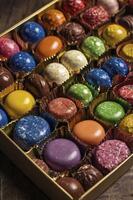 Colorful Chocolate Truffles in Box Delicious Assortment Sweet Treat photo
