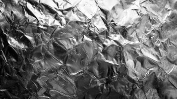 Crumpled Foil Texture Close-up Abstract Metallic Silver Background Design photo