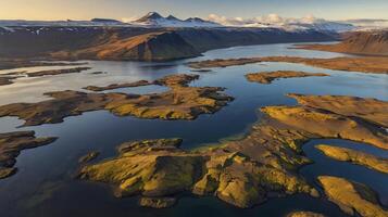 Aerial View of Icelandic Landscape with Lake and Mountains During Sunrise photo