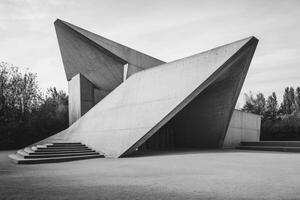 Exploring Unique Concrete Architecture Minimalist Building and Surrounding Green Space photo