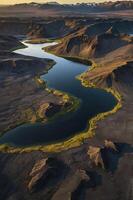 Aerial View of River Flowing Through Iceland's Dramatic Highland Landscape photo
