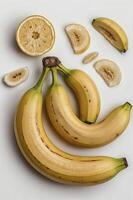 Fresh Bananas and Lemon Slices on a White Surface Still Life photo