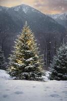Snowy Christmas Tree with Lights in a Mountainous Winter Landscape photo