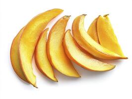 Fresh Mango Slices Arranged on White Background Ready to Be Served photo