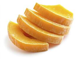 Dried Mango Slices Stacked Deliciously on White Background for Snack photo
