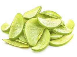 Pile of Green Apple Slices with Frosting on White Background photo