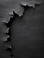Torn Black Paper Revealing Texture and Depth for Creative Design Projects photo